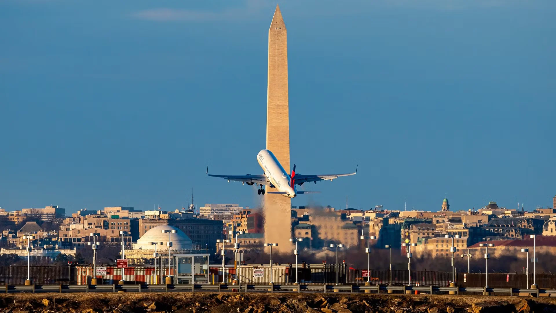 1773674074373_washington d c january 22 2021 delta airlines airbus a321 takes off from ronald reagan national airport with the washington monument in the background 1